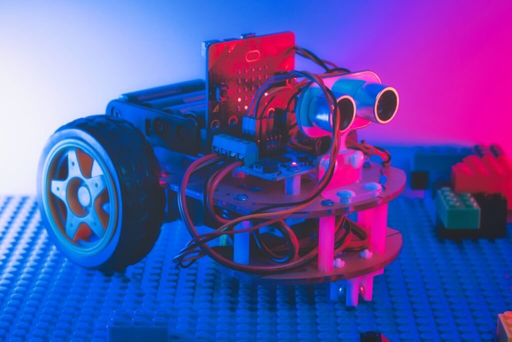 a robot made of legos sitting on top of a table